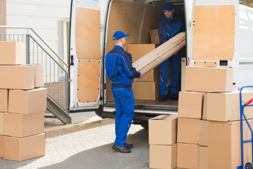 Removal team planning a home move in a Lambeth residential street