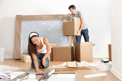 Workers loading items safely into a van