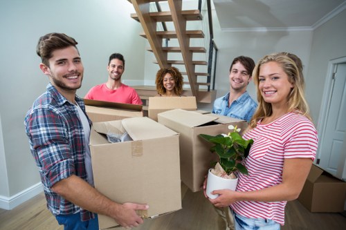 Local removals team handling a move in a Lambeth residential street
