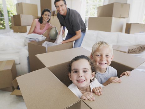 Local movers handling furniture in a Lambeth street