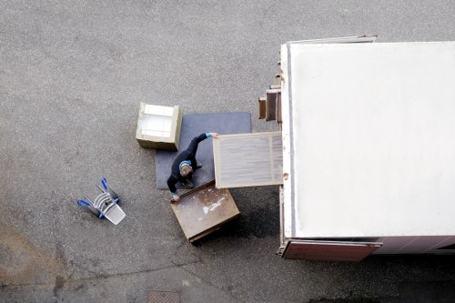 Removal team loading household items in a residential Lambeth street