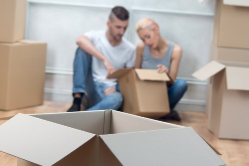 Professional movers preparing items for transport in Lambeth