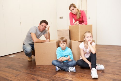 Careful packing of fragile items for a home relocation in Lambeth
