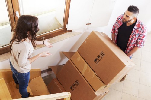 Transport team moving household items during a removal service
